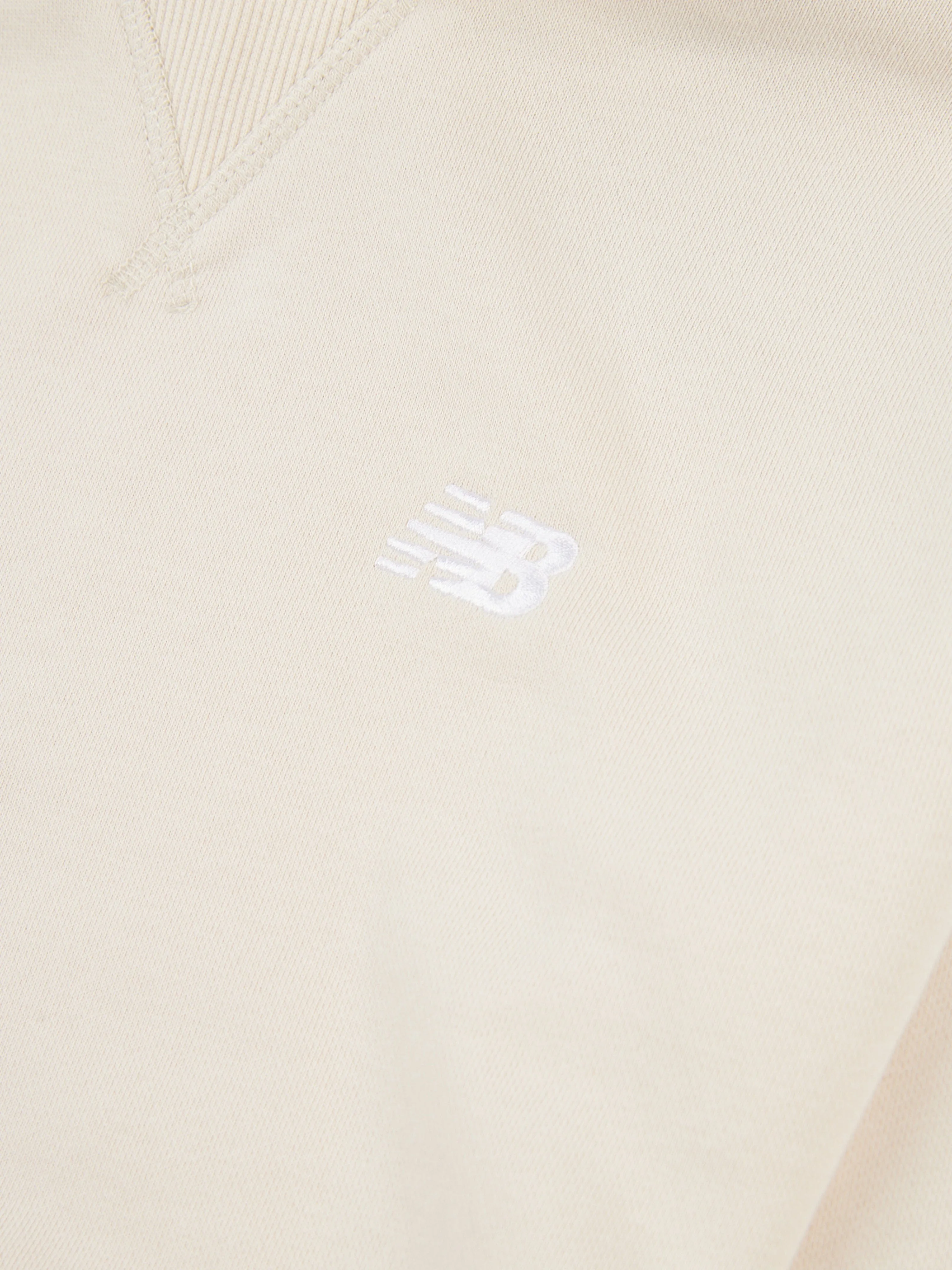 New Balance Mädchen French Terry Kapuzenpullover mit kleinem Logo in Beige